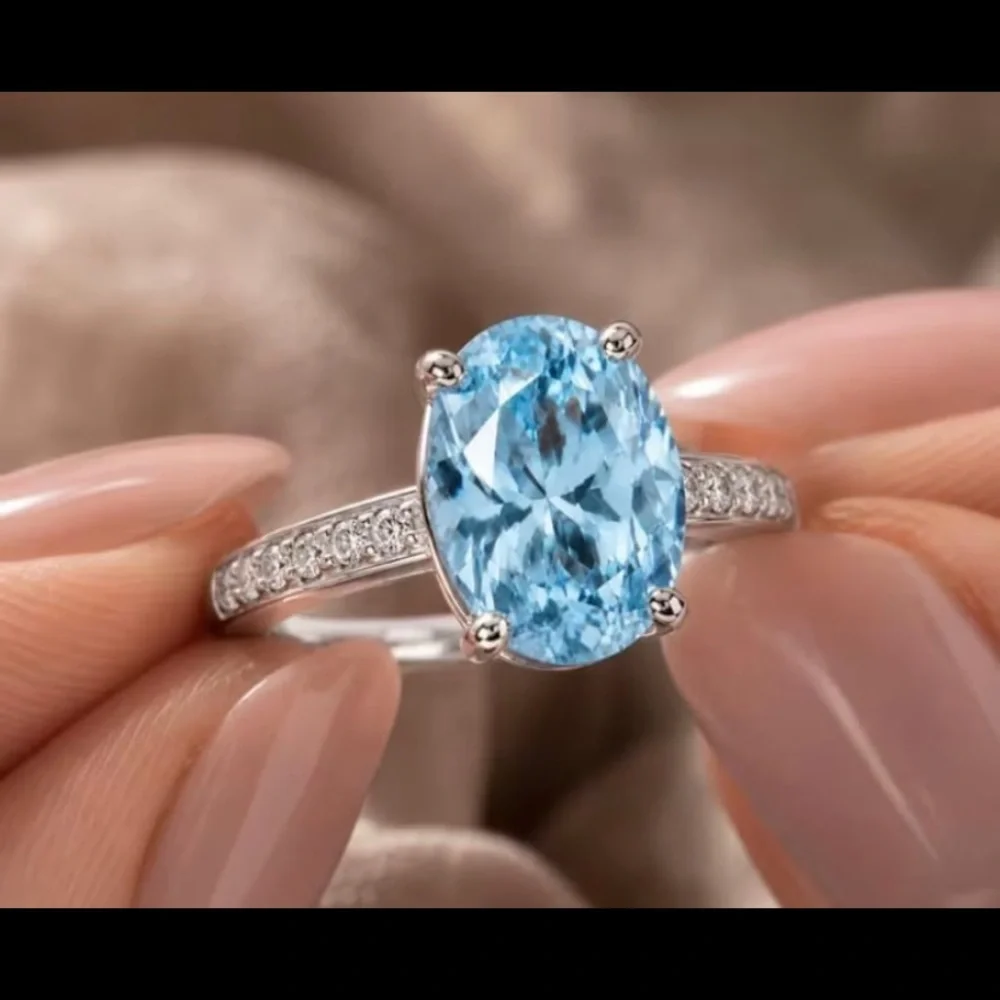 Sterling Silver Oval Blue Topaz Ring with Pavé Accents